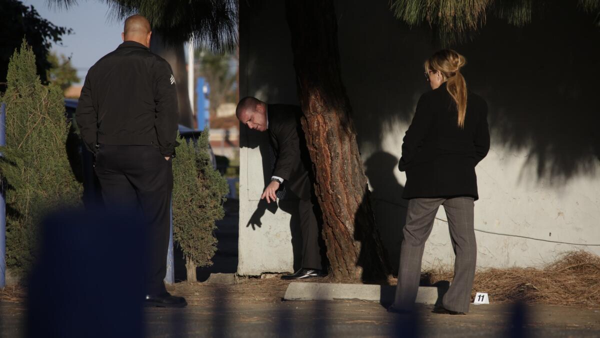 Los Angeles police investigators at the scene of a fatal shooting Saturday morning in Leimert Park.