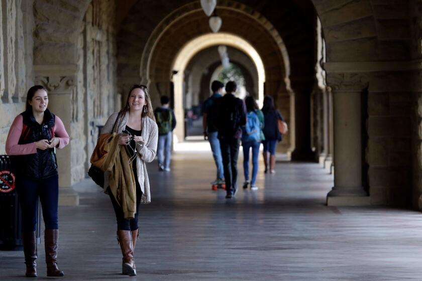 Students walk on campus at Stanford University.