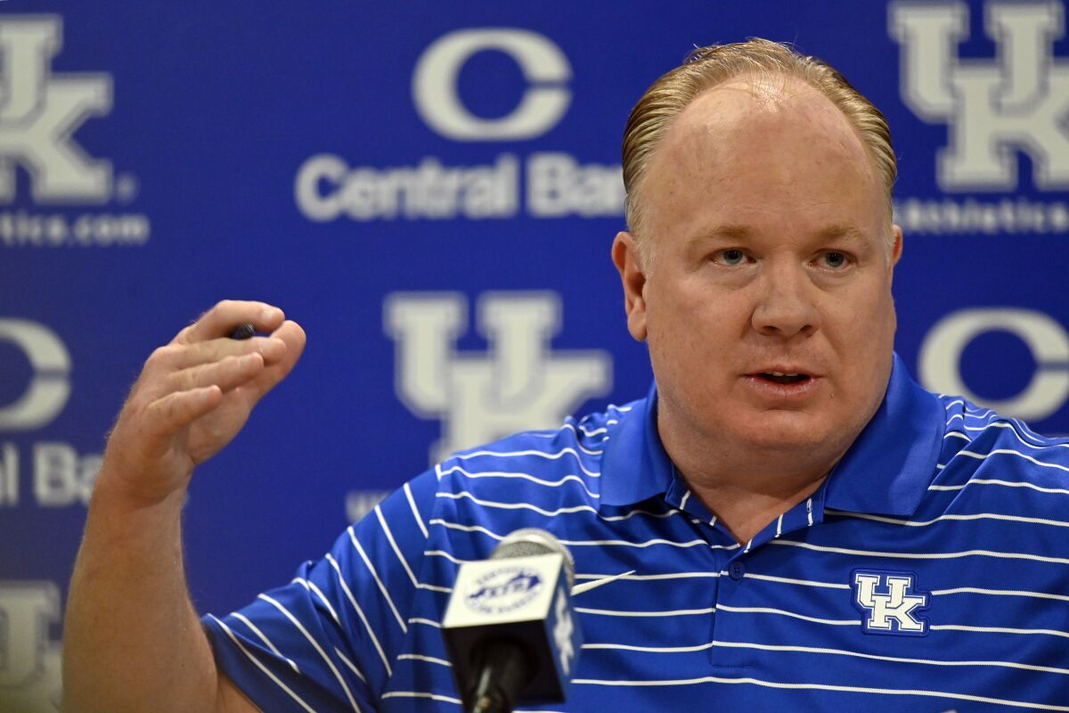 Kentucky coach Mark Stoops answers questions during the NCAA college football team's media day in Lexington, Ky., Wednesday, Aug. 3, 2022. (AP Photo/Timothy D. Easley)