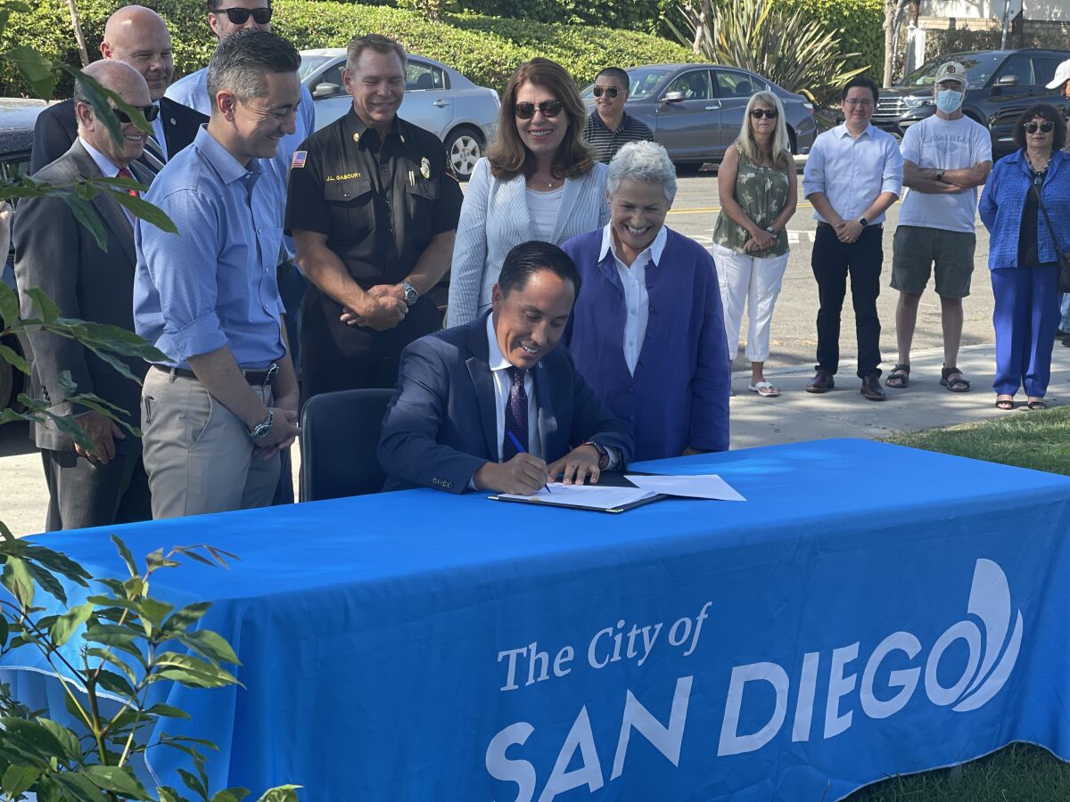Mayor Todd Gloria signs two pieces of legislation for infrastructure funding. 