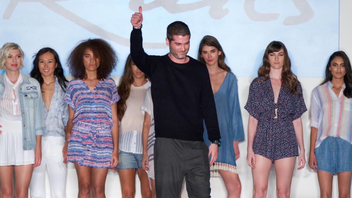 MAFI award winner Jeff Abrams, center, with models wearing his Rails spring/summer 2017 collection, presented at Union Station on Oct. 18.