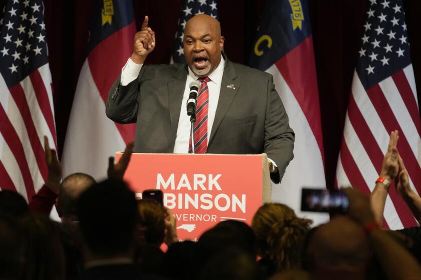 FILE - North Carolina Lt. Gov. Mark Robinson, Republican candidate for governor, speaks at an election night event in Greensboro, N.C., Tuesday, March 5, 2024. (AP Photo/Chuck Burton, File)