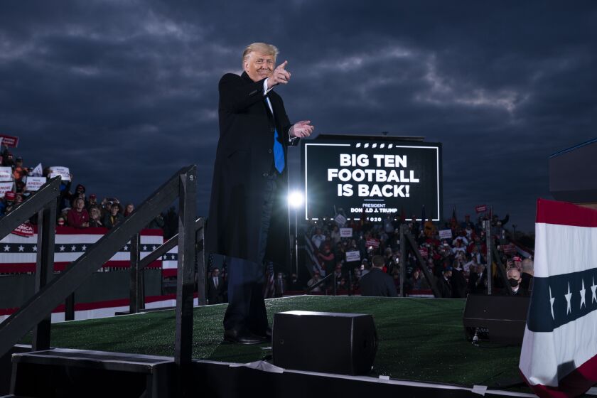 President Donald Trump points to the crowd after speaking during a campaign rally at Pickaway Agricultural and Event Center, Saturday, Oct. 24, 2020, in Circleville, Ohio. (AP Photo/Evan Vucci)