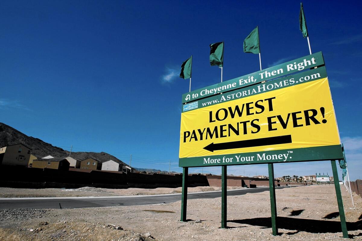 As the housing market heated up in the mid-2000s, Wall Street banks rushed to market high-yielding, mortgage-related securities, each of which required a rating on their credit quality by one of the three firms that dominated the market. Above, a sign advertising a new housing development in Las Vegas in 2009.