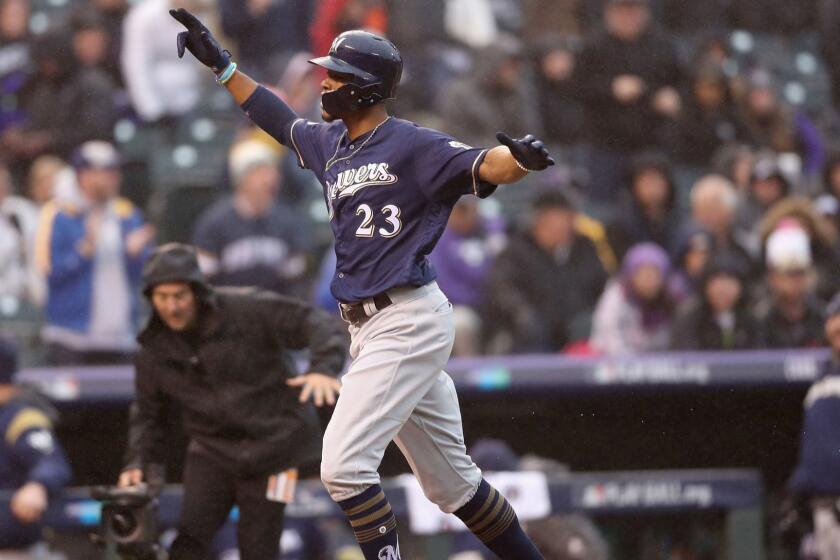 DENVER, CO - OCTOBER 07: Keon Broxton #23 of the Milwaukee Brewers celebrates after hitting a solo homerun in the ninth inning of Game Three of the National League Division Series against the Colorado Rockies at Coors Field on October 7, 2018 in Denver, Colorado. (Photo by Matthew Stockman/Getty Images) ** OUTS - ELSENT, FPG, CM - OUTS * NM, PH, VA if sourced by CT, LA or MoD **
