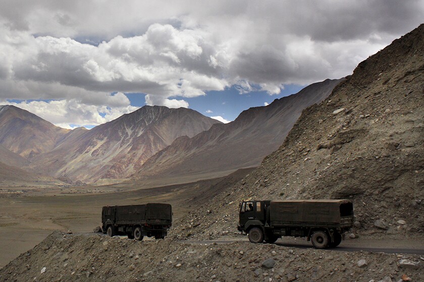 Army trucks on a mountain road