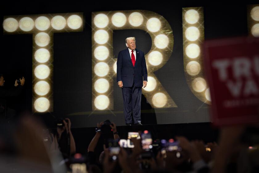 Milwaukee, WI - July 18: Former President Trump walks onstage for his nomination acceptance speech Thursday night at the Republican National Convention on Thursday, July 18, 2024 in Milwaukee, WI. (Jason Armond / Los Angeles Times)