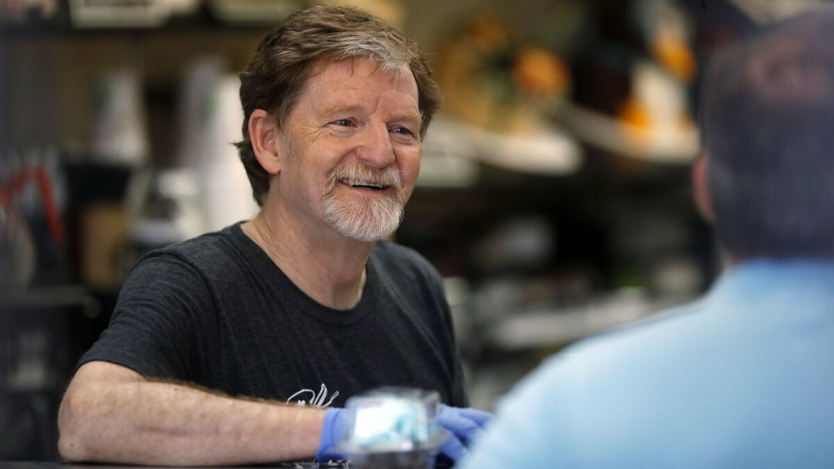Baker Jack Phillips, owner of Masterpiece Cakeshop, manages his store on June 4 in Lakewood, Colo.