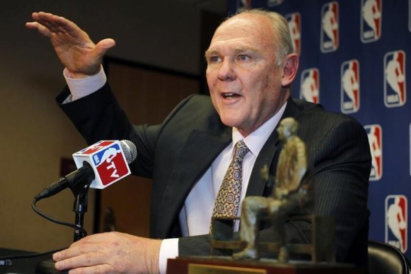 Former Denver Nuggets Coach George Karl accepts the award for coach of the year back in May.