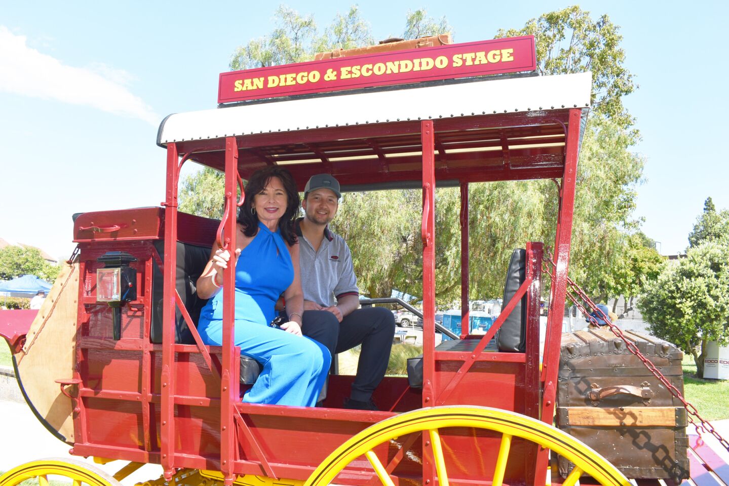 Suzanne Kropf with her son, Kyle Kropf, in the RB Historical Society’s mud wagon.