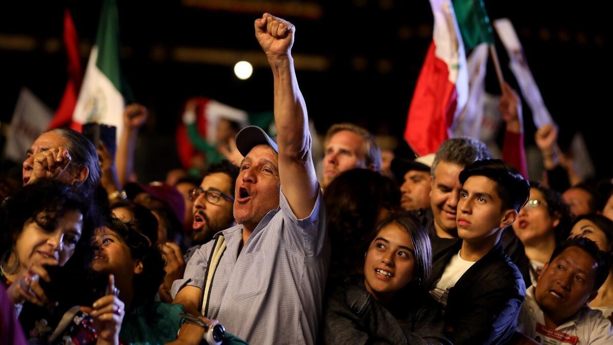 Supporters of Andres Manuel Lopez Obrador celebrate in Mexico City's Zocalo after getting the preliminary results of the general elections on July 2.