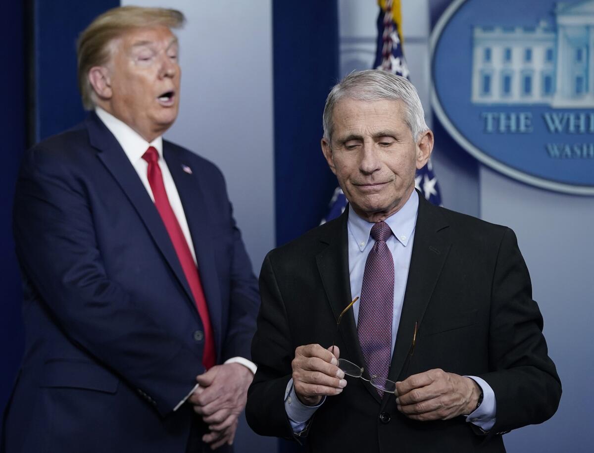 WASHINGTON, DC - APRIL 22: Dr. Anthony Fauci (R), director of the National Institute of Allergy and Infectious Diseases, and U.S. President Donald Trump participate in the daily coronavirus task force briefing at the White House on April 22, 2020 in Washington, DC. Dr. Robert Redfield, director of the Centers for Disease Control, has said that a potential second wave of coronavirus later this year could flare up again and coincide with flu season. (Photo by Drew Angerer/Getty Images)