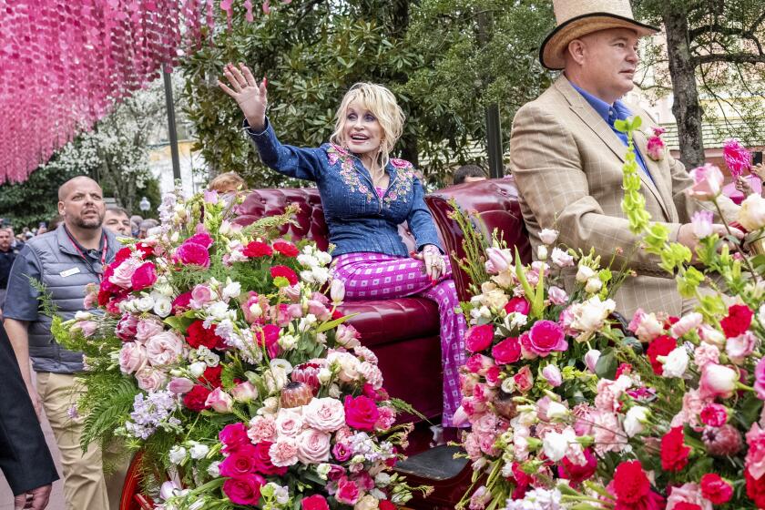 Dolly Parton is seen Dollywood's Season Passholder and Media Day Parade on Friday, March 8, 2024, in Pigeon Forge, Tenn. (Photo by Amy Harris/Invision/AP)