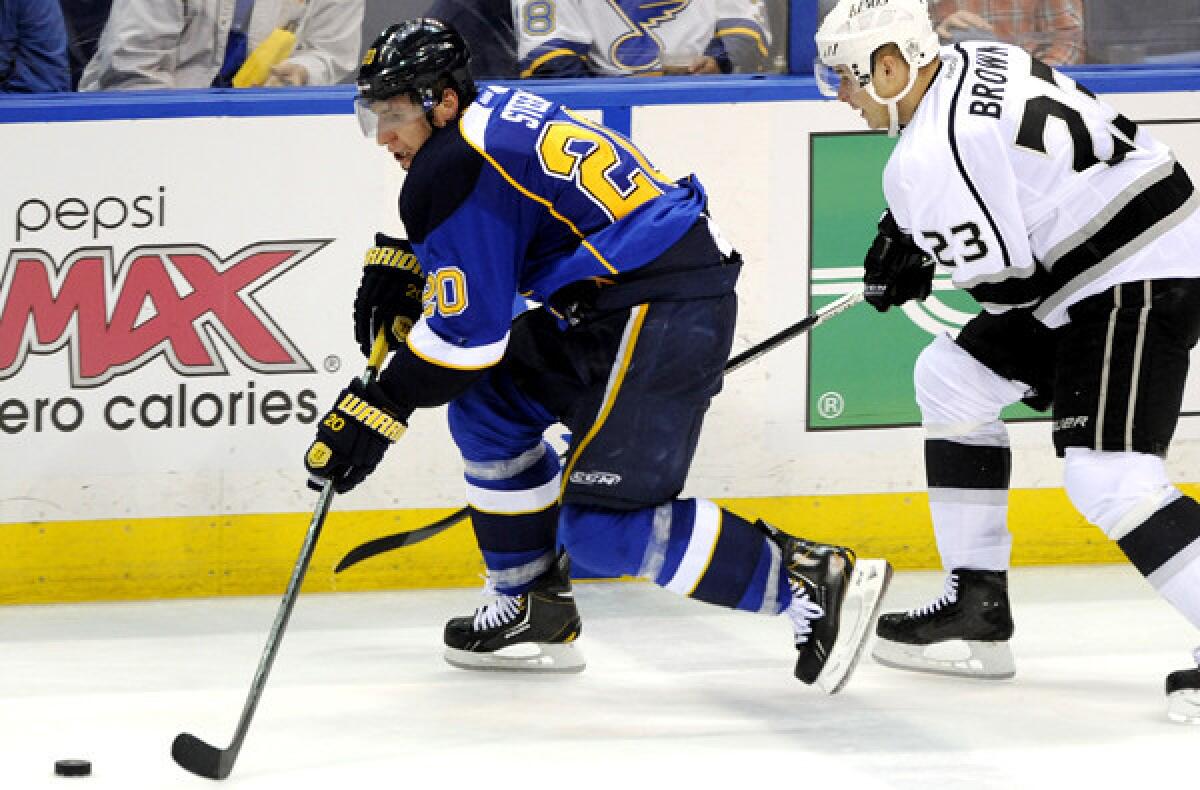 Kings right wing Dustin Brown tries to chase down Blues left wing Alexander Steen during the third period of Game 1 on Tuesday night in St. Louis.