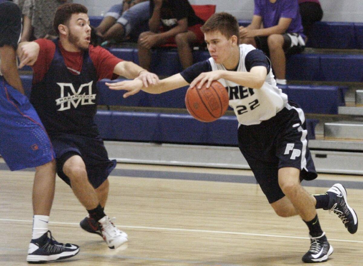 Flintridge Prep's Robert Cartwright, right, scored a game-high 31 points in a 62-41 loss to Maranatha.