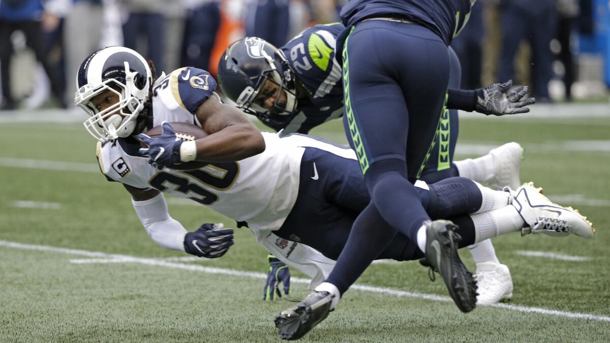 Rams running back Todd Gurley dives for extra yards in the first half on Sunday.