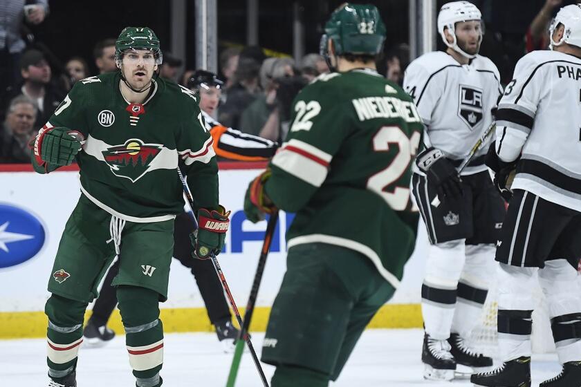 The Minnesota Wild's Marcus Foligno (17) celebrates with teammate Nino Niederreiter (22) after a goal by Niederreiter in the second period against the Los Angeles Kings at the Xcel Energy Center in St. Paul, Minn., on Tuesday, Jan. 15, 2019. (Aaron Lavinsky/Minneapolis Star Tribune/TNS) ** OUTS - ELSENT, FPG, TCN - OUTS **