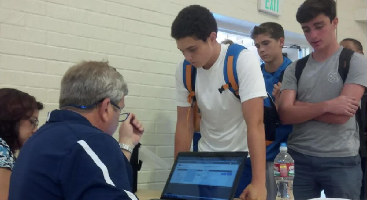 Loyola athletic trainer Tim Moscicki runs a test, called baselining, on a student in 2014 to help diagnose concussions.