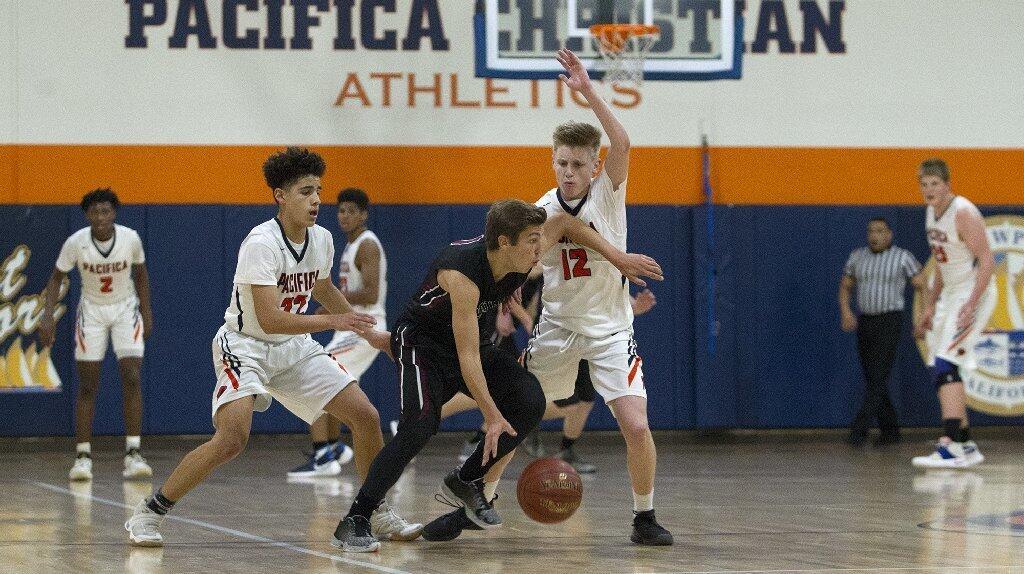 Pacifica Christian High's Cal Whitney (12) and Timmy Bahadoor double-team Foothill Tech's Colin Vallance.