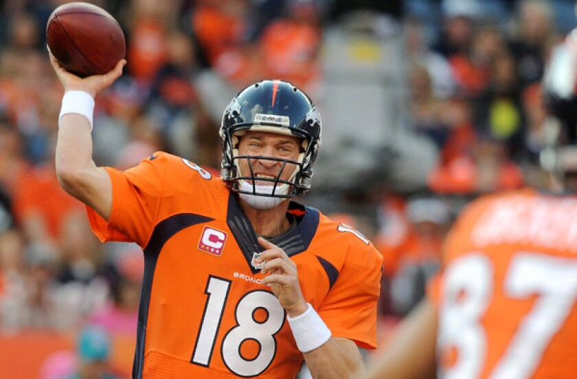 Broncos quarterback Peyton Manning throws a pass to wide receiver Eric Decker in the fourth quarter Sunday.