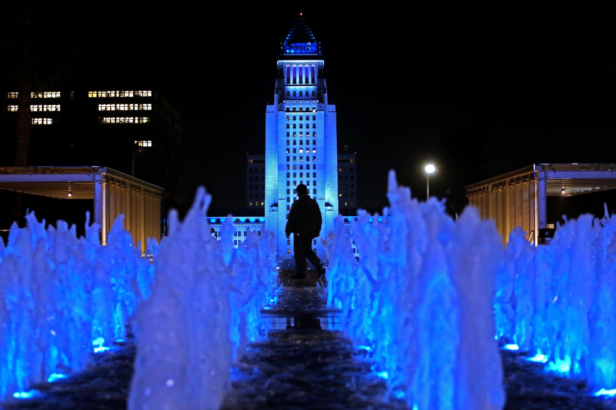 City Hall and the Music Center plaza fountain are lit in Dodger blue.