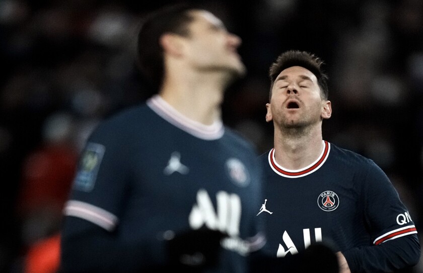 PSG's Lionel Messi, right, reacts after missing a chance to score during the French League One soccer match between Paris Saint-Germain and Nice at the Parc des Princes stadium in Paris, France, Wednesday, Dec. 1, 2021. (AP Photo/Thibault Camus)