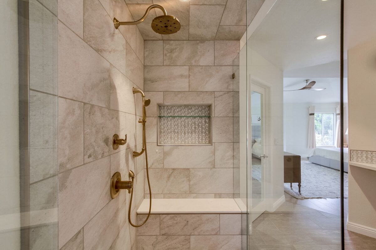To accent whites and grays in this UTC-area home’s bath, Raj Swenson used textural detail in her design.