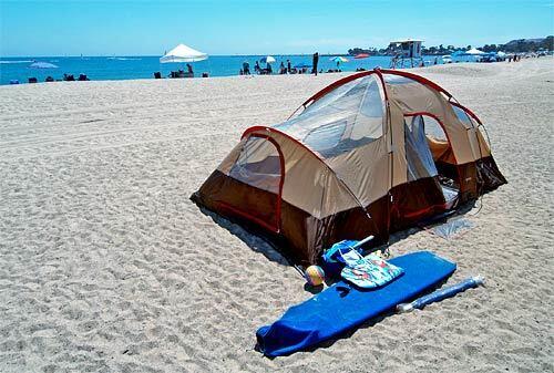 A tent stakes out prime camping real estate at Doheny State Beach in south Orange County.