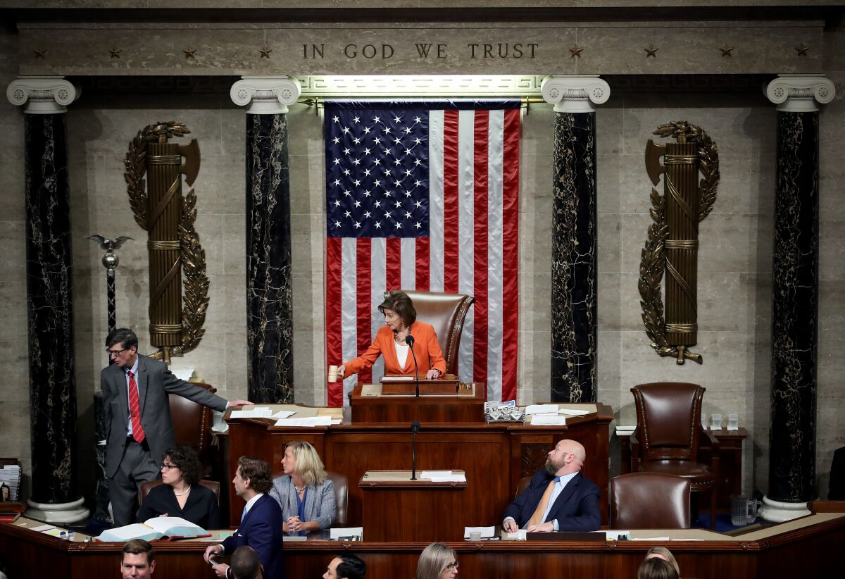 House Speaker Nancy Pelosi gavels the close of the vote on Oct. 31 that formalized the impeachment inquiry into President Trump.