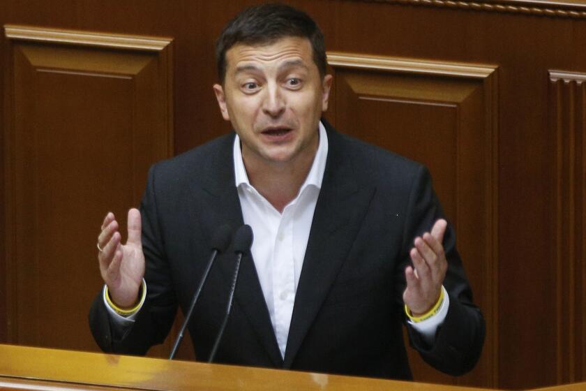 FILE - In this file photo taken on Aug. 29, 2019, Ukrainian President Volodymyr Zelenskiy speaks to newly elected Ukrainian parliament deputies during parliament session in Kyiv, Ukraine. Zelenskiy, the comedian elected Ukraine’s leader in April, took office pledging to focus on ending the deadly separatist fighting in the country’s east, fomented by Russia. But now, barely 100 days in power, he finds himself at the center of a political furor involving the United States, Ukraine’s friend and backer. (AP Photo/Efrem Lukatsky, File)