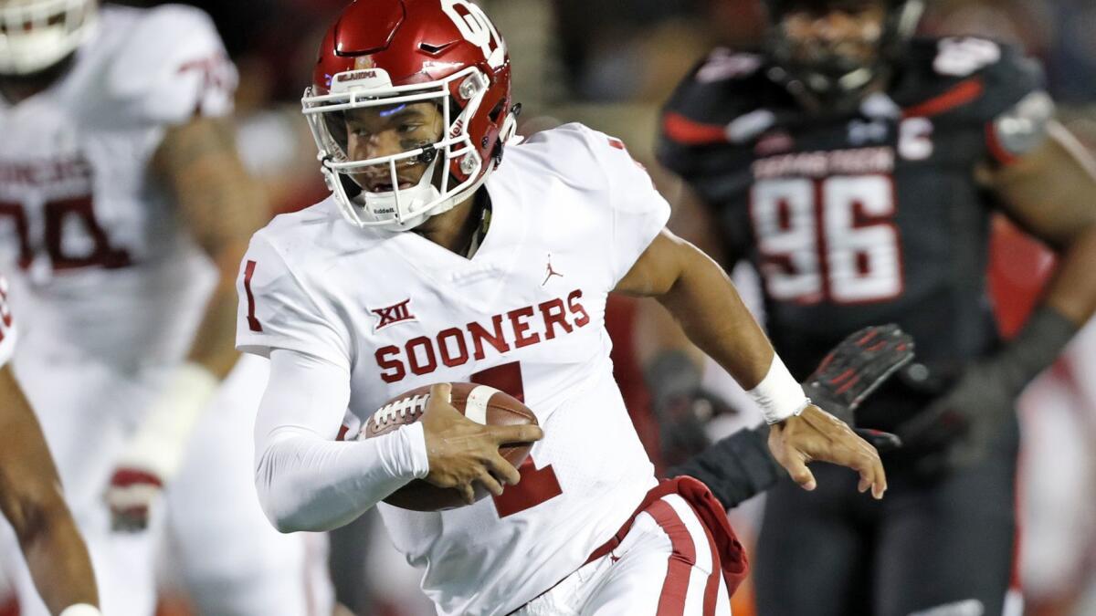 Oklahoma quarterback Kyler Murray scores a touchdown during the first half against Texas Tech on Saturday.