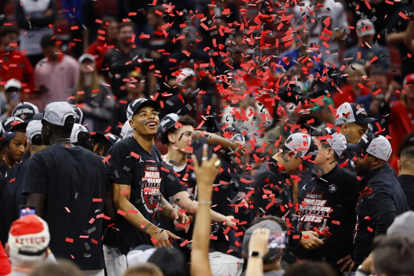 Louisville, KY - March 26: San Diego State's Keshad Johnson celebrates after the Aztecs beat Creighton 57-56 in an Elite 8 game in the NCAA Tournament on Sunday, March 26, 2023 in Louisville, KY. (K.C. Alfred / The San Diego Union-Tribune)