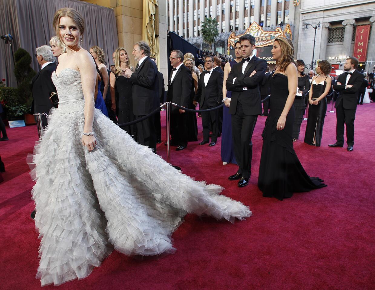 Actress Amy Adams arrives at the 2013 Academy Awards in a princess ball gown designed by Oscar de la Renta.