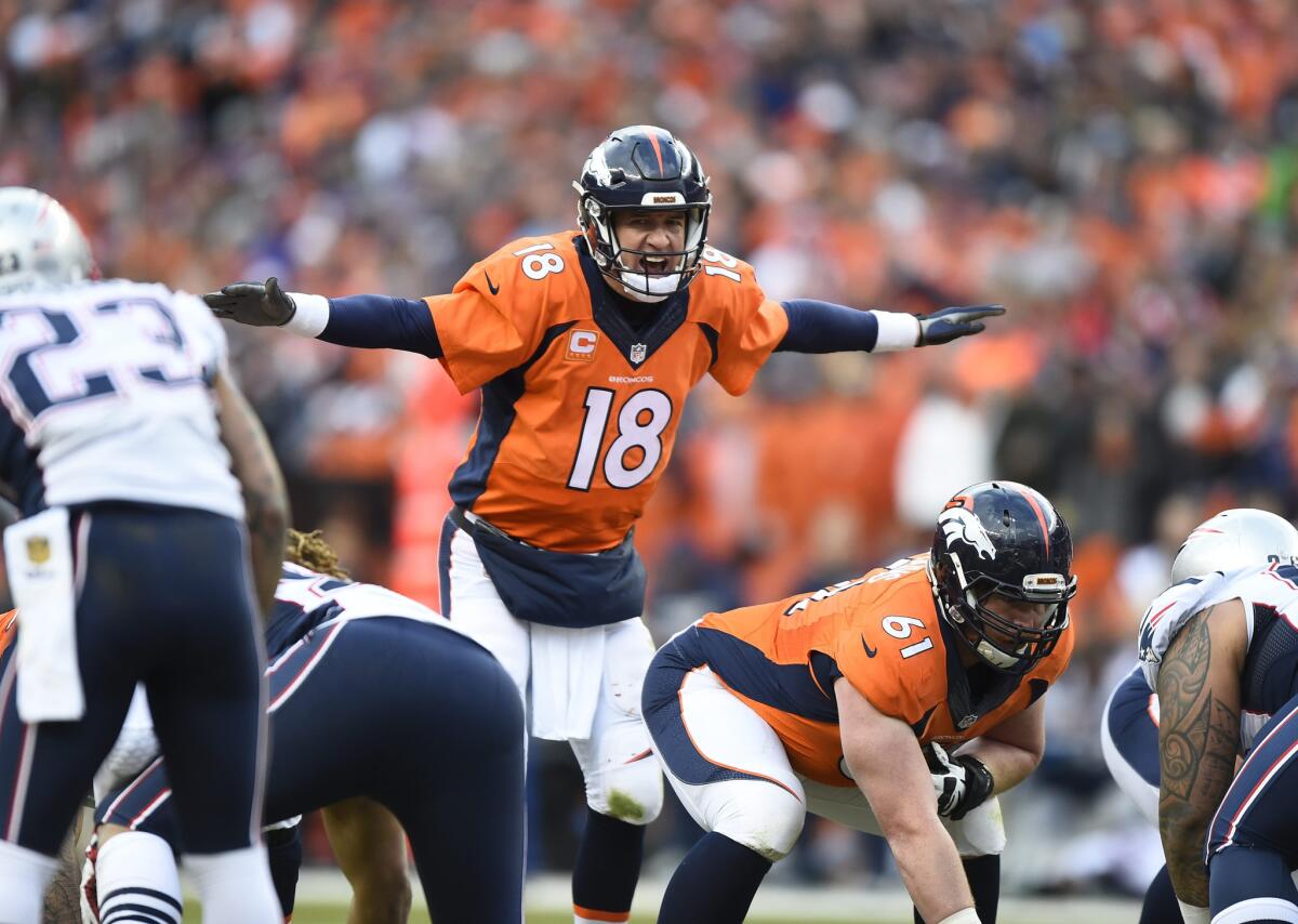 Broncos quarterback Peyton Manning calls out play signals to his offense during the AFC Championship game against the Patriots on Jan. 24.