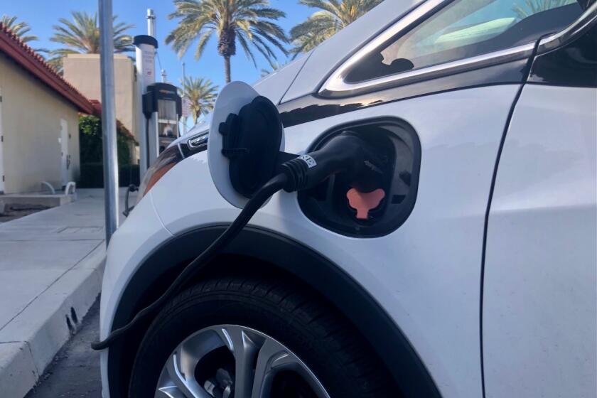 An electric vehicle at a charging station in Chula Vista in March 2021.