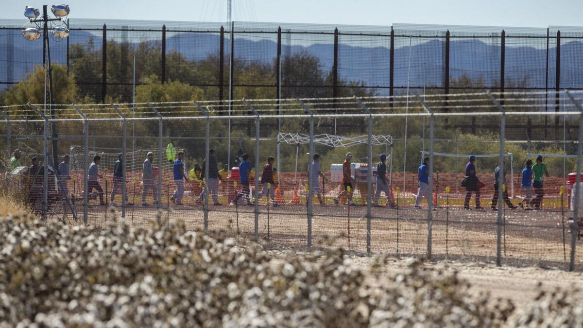 Migrant teens are led in a line inside the Tornillo detention camp holding more than 2,300 migrant teens in Tornillo, Texas on Nov. 15, 2018.