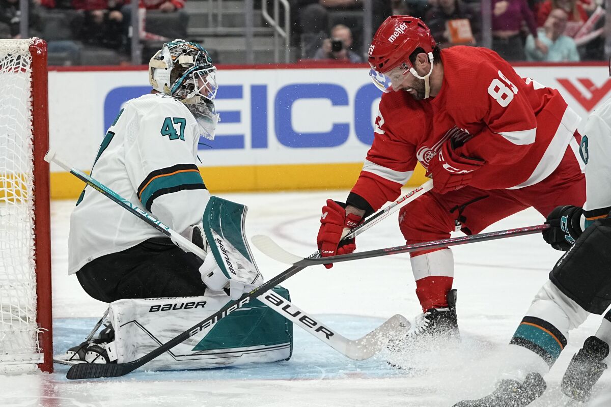 San Jose Sharks goaltender James Reimer (47) stops a Detroit Red Wings center Sam Gagner (89) shot in the second period of an NHL hockey game Tuesday, Jan. 4, 2022, in Detroit. (AP Photo/Paul Sancya)