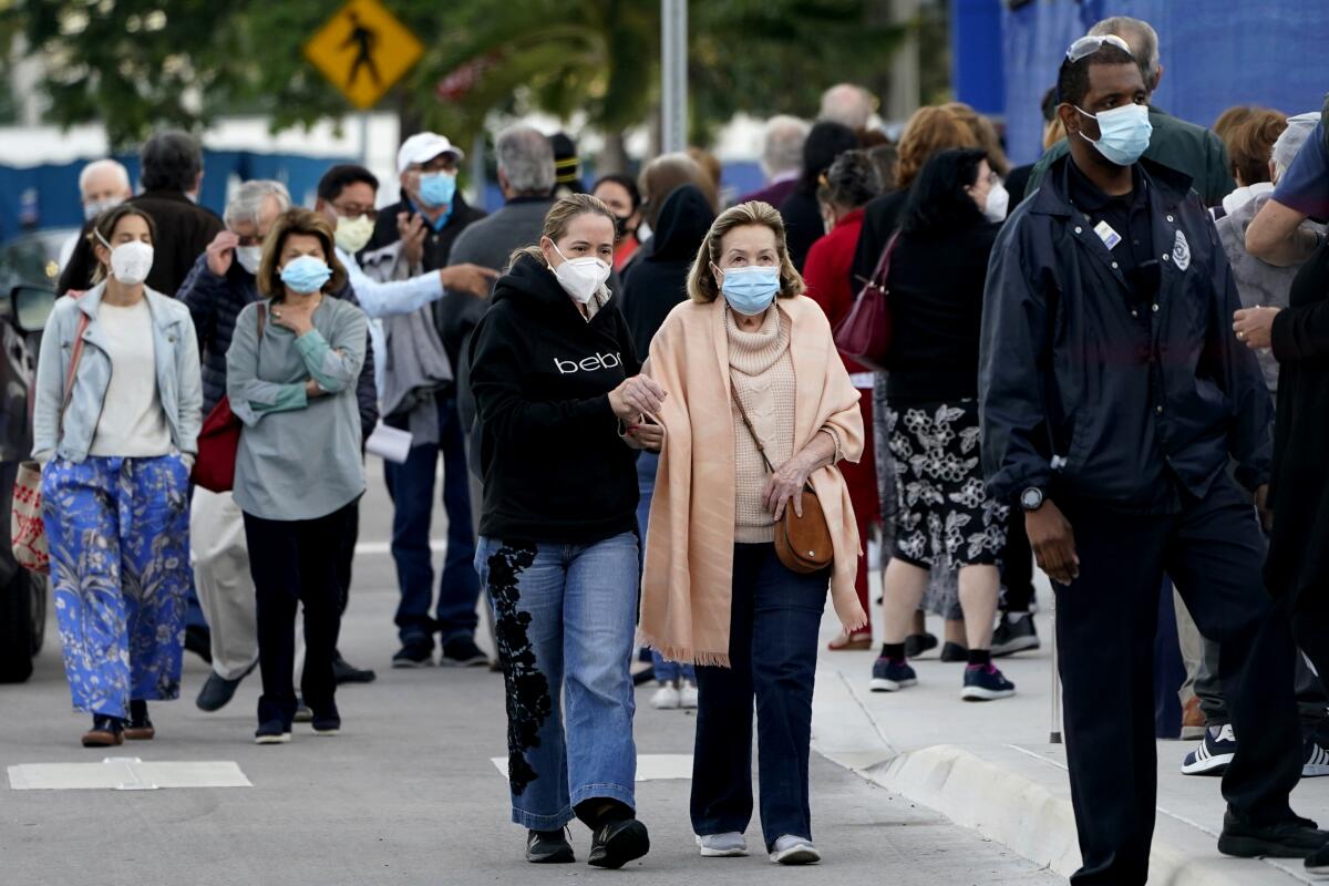 People wear masks at Jackson Memorial Hospital in Miami.