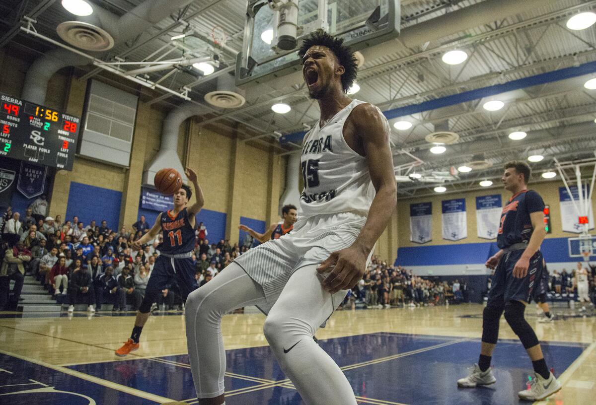 Sierra Canyon 6-11 junior phenom Marvin Bagley III reacts after dunking the ball over Chaminade on Dec. 5.