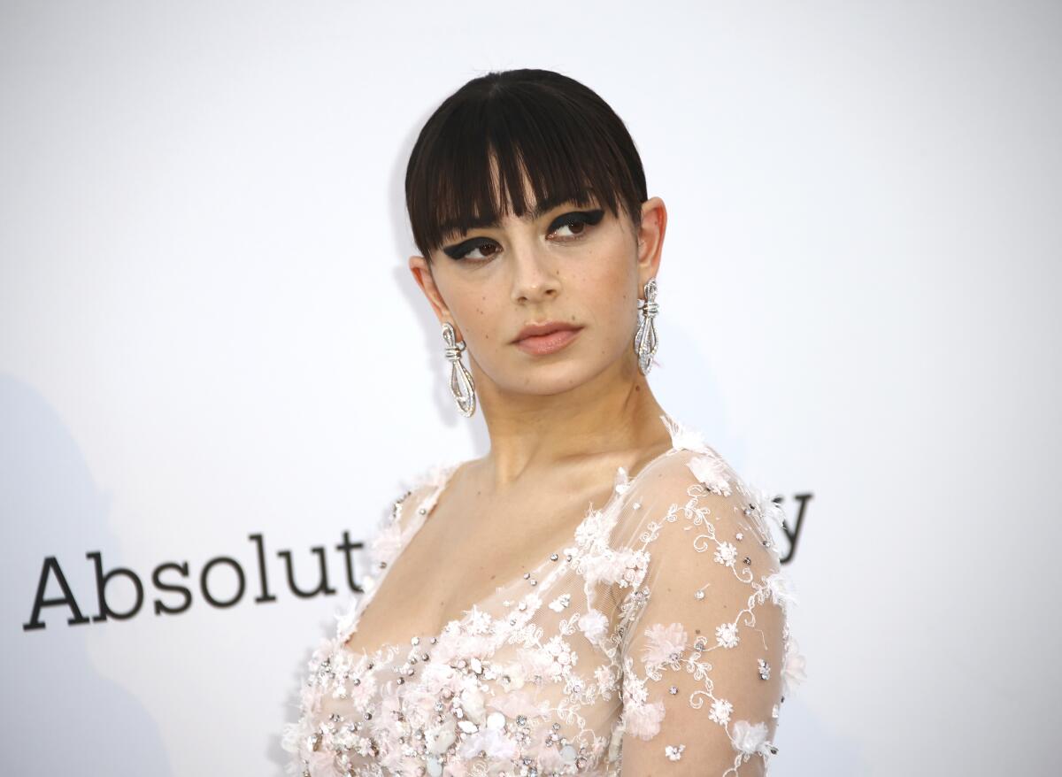 Charli XCX poses for photographers 