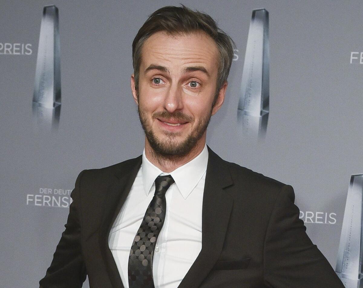 TV comic Jan Boehmermann arrives for the German TV awards in Duesseldorf, Germany. German prosecutors said Tuesday that they have dropped an investigation of Boehmermann.