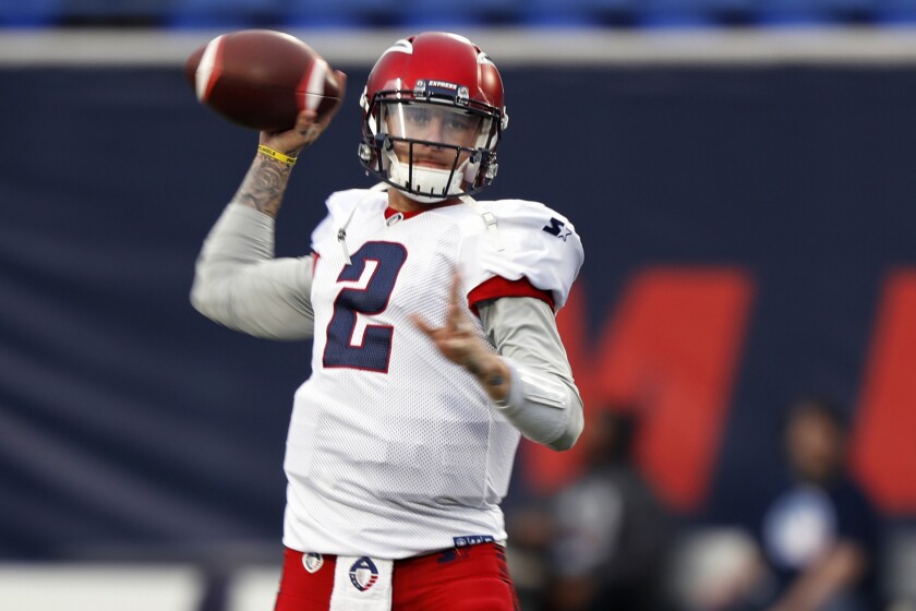FILE- In this March 24, 2019, file photo, Memphis Express quarterback Johnny Manziel warms up before an AAF football game against the Birmingham Iron in Memphis, Tenn. After a self-destructing pro career that never close to matching his enormous potential, Manziel says he's done with the game that gave him his catchy moniker (Johnny Football), even as he's dabbling in a fledgling, fan-controlled arena league that was set to begin play Saturday night in suburban Atlanta. (AP Photo/Wade Payne, File)