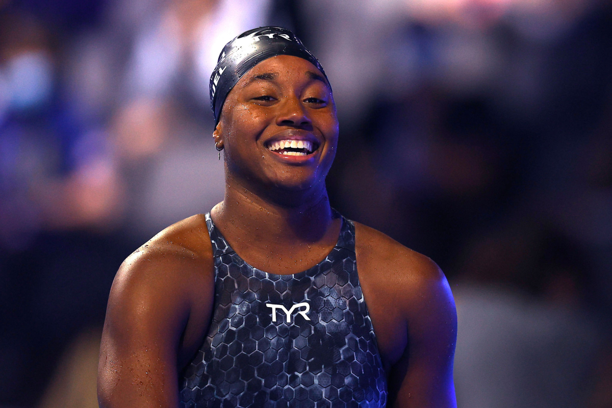 Simone Manuel smiles after winning the Women's 50-meter freestyle final.