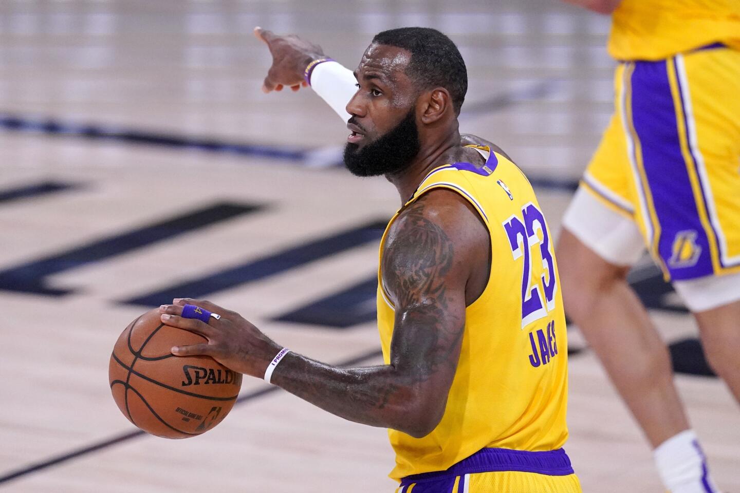 Lakers forward LeBron James directs his teammates during Game 1.