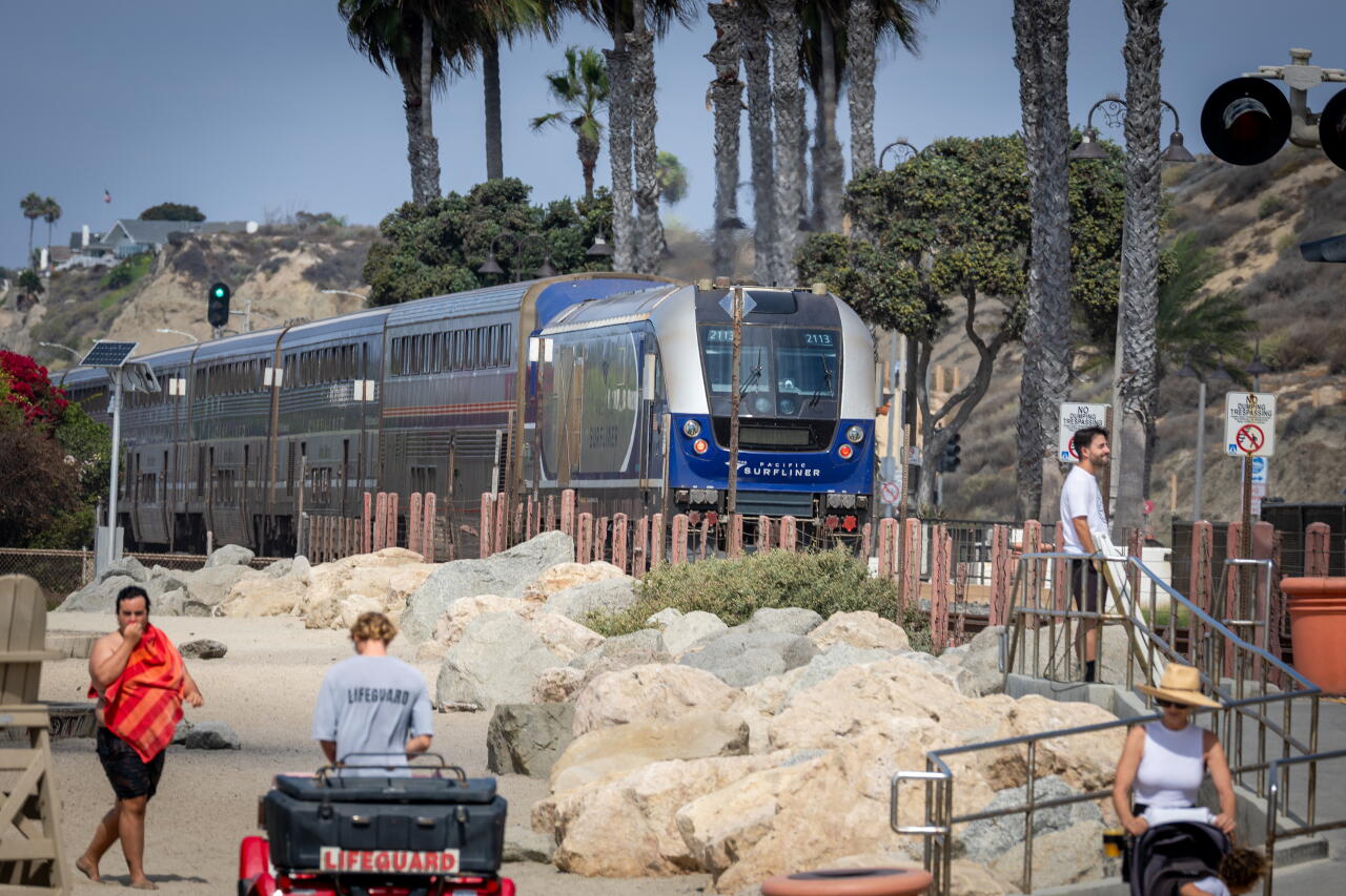 An Amtrak Pacific Surfliner train passes along the coastal tracks in San Clemente.