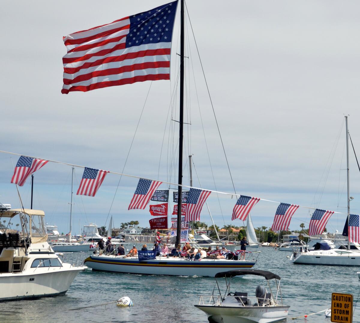 A large sailboat bearing an equally large American flag navigated the narrow waterway.