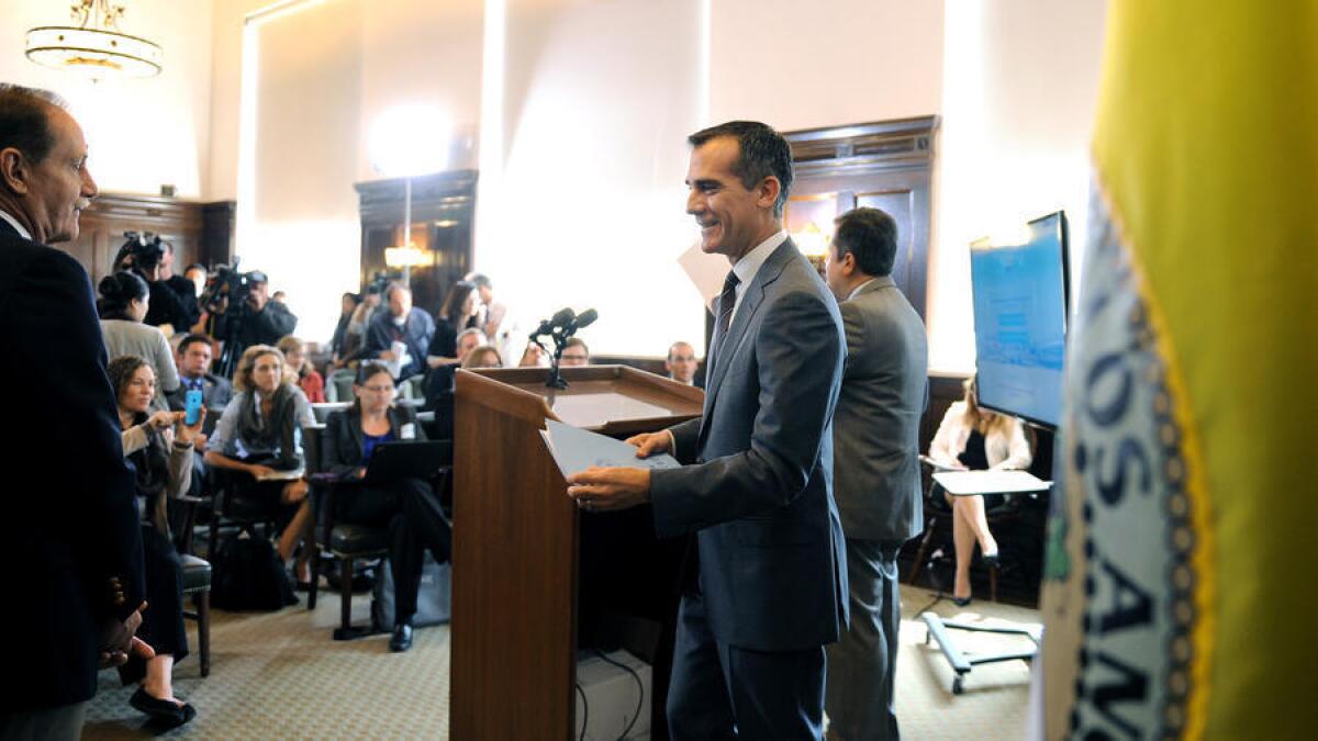 Labor leaders won concessions that Mayor Eric Garcetti, right, had for a long time resisted, such as the preservation of healthcare plans that require no premium payments from many members.