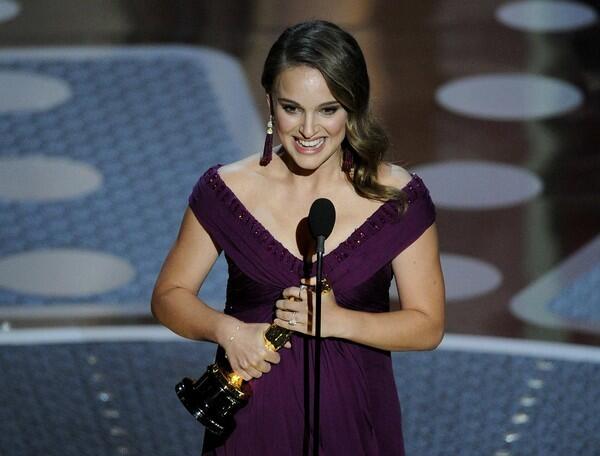 Natalie Portman keeps her Golden Globes cackle at bay