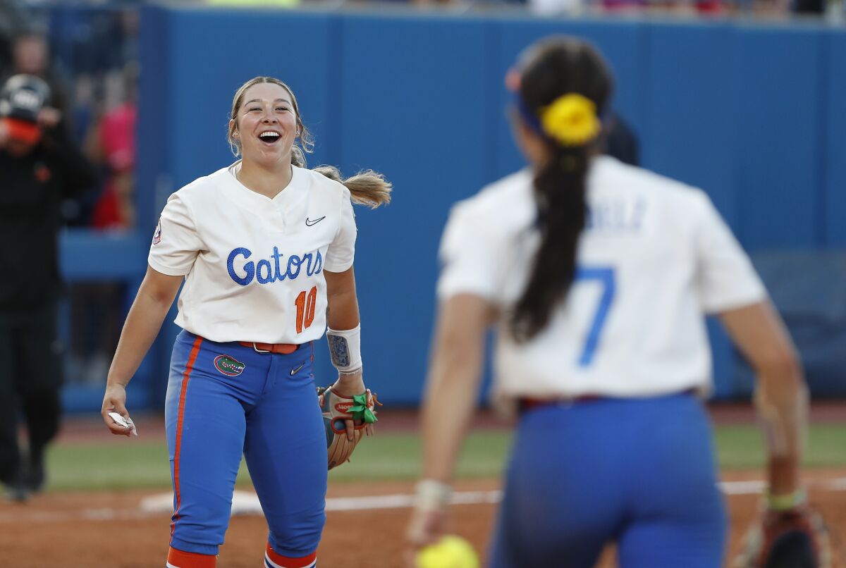 Florida's Natalie Lugo (10) celebrates after the final out against Oregon State in an NCAA softball Women's College World Series game Thursday, June 2, 2022, in Oklahoma City. (AP Photo/Alonzo Adams)