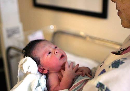 Newborn Marla Perez was born minutes after the official U.S. population estimate hit 300 million.